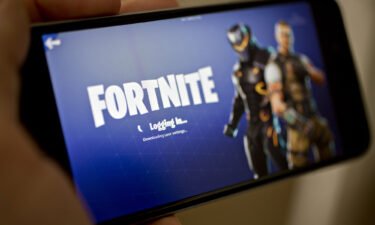 The Epic Games Fortnite: Battle Royale video game is displayed on an iPhone.