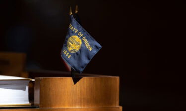 Oregon approves the nation's first new congressional map. The Oregon State flag is pictured here at the Oregon State Capitol in Salem