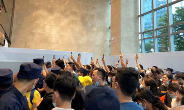 People gathering to demand repayment of loans and financial products at Evergrande's headquarters in Shenzhen on Monday.