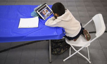 A child attends an online class at a learning hub inside the Crenshaw Family YMCA in Los Angeles