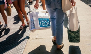 US retail sales increased last month despite rising cases of the Covid-19 Delta variant. Pedestrians carry shopping bags in the SoHo neighborhood of New York