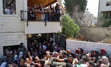 Mourners carry the body of Osama Sobh