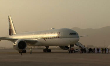 The US government is working to help about 100 US citizens and permanent residents leave Afghanistan. Passengers here board second Qatar Airways plane to arrive at Kabul airport on September 10.