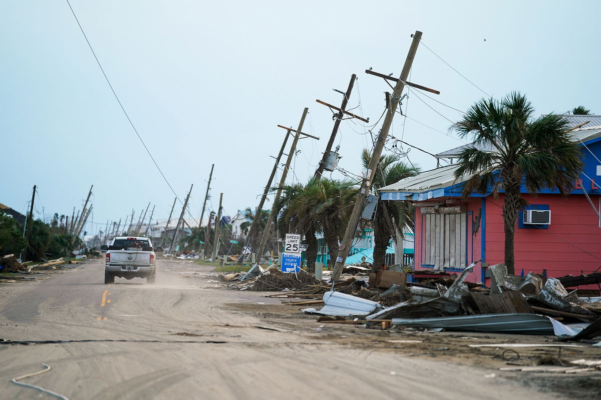 <i>Sean Rayford/Getty Images</i><br/>A motorist drives down a road in the wake of Hurricane Ida on September 4