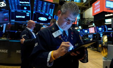 Trader John Panin works on the floor of the New York Stock Exchange