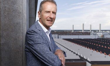 Volkswagen Group CEO Herbert Diess poses above the company grounds during a photo shoot.