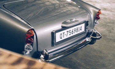 The miniature James Bond DB5 includes a changeable digital license plate and an exhaust pipe smokescreen feature.