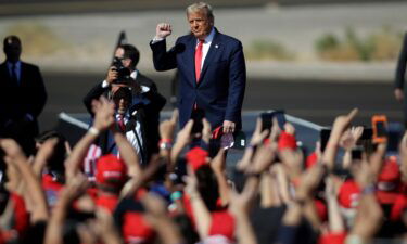 Then-President Donald Trump arrives at a campaign rally on October 28
