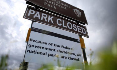 A sign near the entrance to the Everglades National Park is seen indicating it is closed on October 7