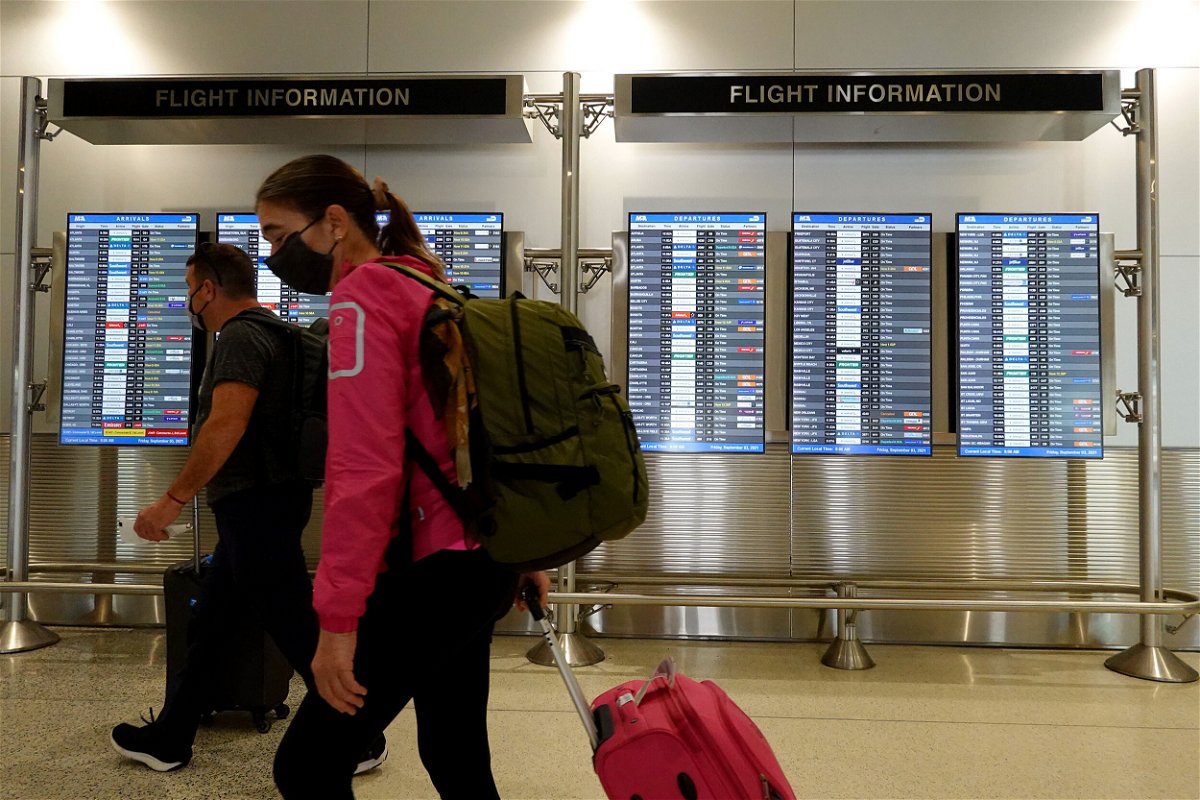 <i>Joe Raedle/Getty Images</i><br/>Travelers make their way through the Miami International Airport before starting the Labor Day weekend on September 3 in Miami