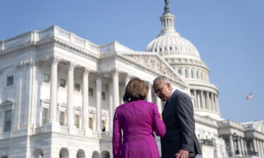 Senate Majority Leader Chuck Schumer speaks to House Speaker Nancy Pelosi outside the Capitol in June.