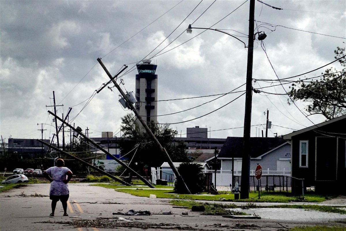 <i>Scott Olson/Getty Images</i><br/>A woman surveys the damage in Kenner