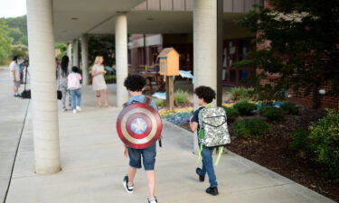 Students arrive on the first day of Knox County Schools at Dogwood Elementary School in Knoxville on August 9
