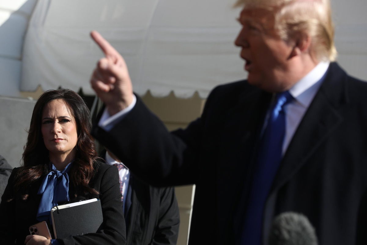 <i>Chip Somodevilla/Getty Images</i><br/>Trump's former press secretary details his mysterious 2019 hospital visit in her book. Stephanie Grisham here listens to former President Donald Trump talking to reporters outside the White House November 08