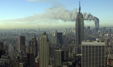 Plumes of smoke pour from the World Trade Center buildings in New York Tuesday