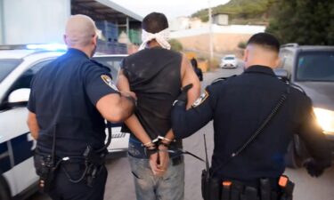 A photo provided by Israel Police shows Zakaria Zubeidi being arrested by Israeli police officers in Umm al Ghanam.