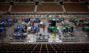 Cyber Ninjas workers examine and recount ballots from the 2020 general election on May 3