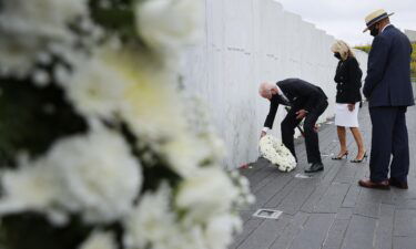 Then-Democratic presidential nominee and former Vice President Joe Biden and Dr. Jill Biden are accompanied by Calvin Wilson as they lay a wreath at the Flight 93 National Memorial on the 19th anniversary of the 9/11 terror attacks September 11