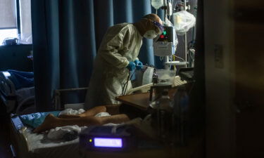A doctor checks on a Covid-19 patient at Providence Cedars-Sinai Tarzana Medical Center in Tarzana