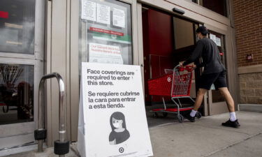 A shopper wearing a protective mask enters a Target Corp. store in Houston