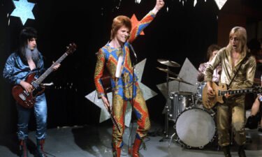 Get ready for the next spacewalk outside the International Space Station with a far-out song list. David Bowie (center) performs with Trevor Bolder (left) and Mick Ronson (right)