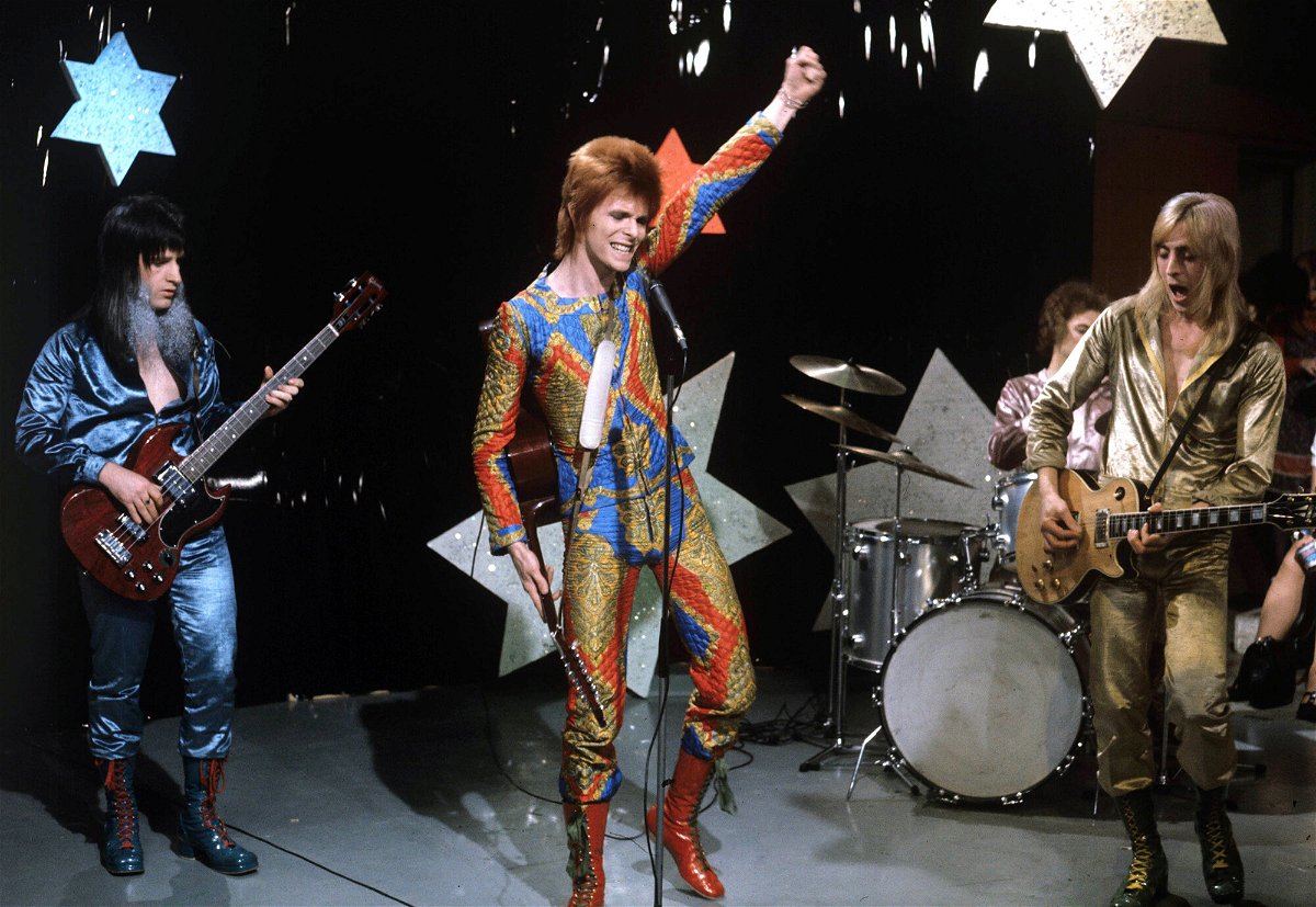 <i>ITV/Shutterstock</i><br/>Get ready for the next spacewalk outside the International Space Station with a far-out song list. David Bowie (center) performs with Trevor Bolder (left) and Mick Ronson (right)
