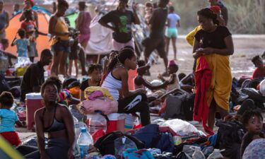 Migrants under the international bridge at a camp on the U.S.-Mexico border on Sept. 21