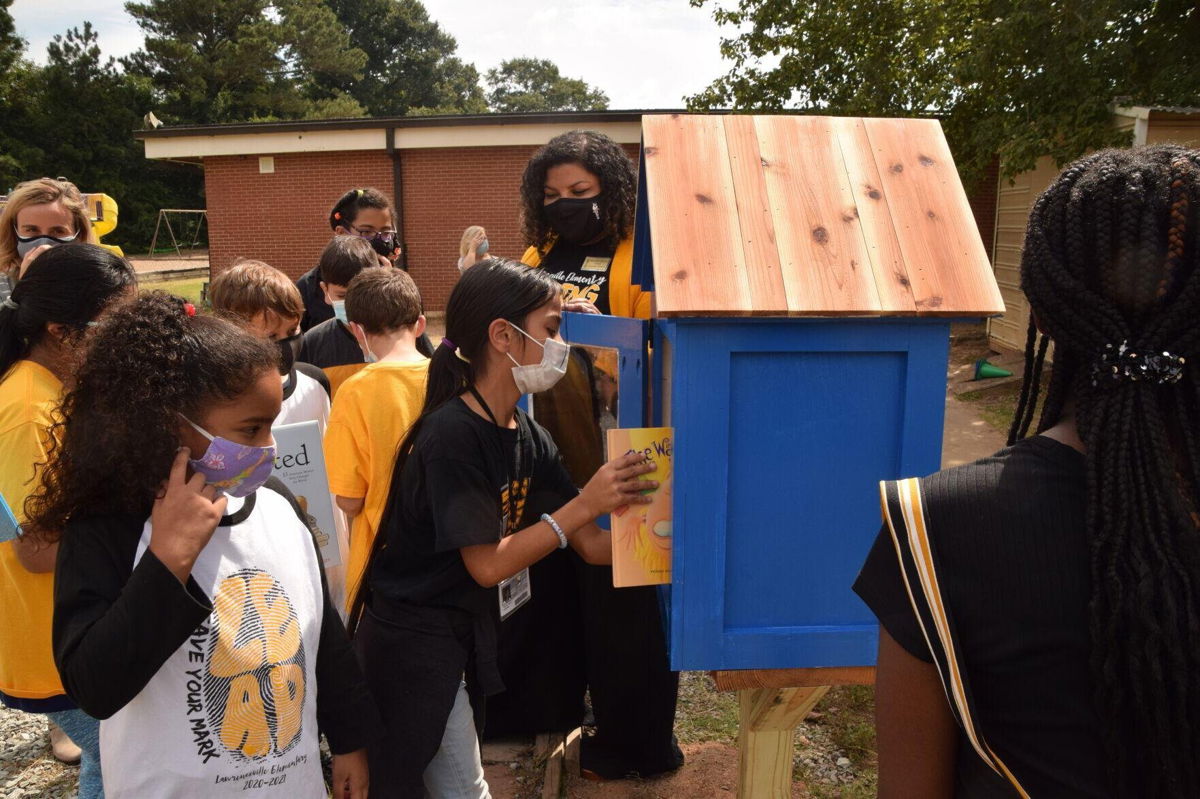 <i>Gwinnett Daily Post</i><br/>Members of the Rotary Club of Lawrenceville unveiled a new Little Library stand at the school's playground this past week