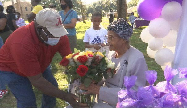 <i>WALA</i><br/>Mrs. Emma Mae Washington sat front and center as parade of family and friends led by Mobile Fire-Rescue drove by.