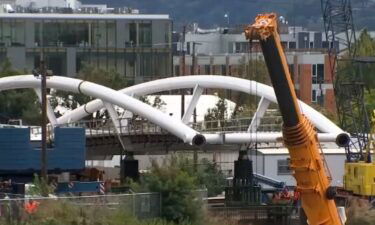 A new pedestrian bridge in Portland Oregon nears completition. The bridge is designed to help make it easier for cyclists and pedestrians to get across a major freeway.