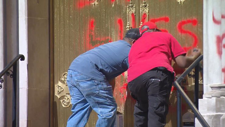 <i>KCNC</i><br/>Crews clean offensive graffiti off of the Cathedral Basilica of the Immaculate Conception in Denver on October 10.