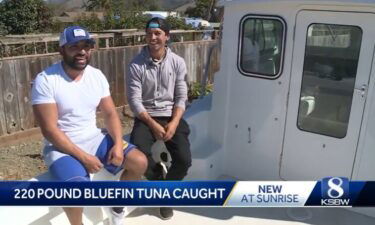 Carlos Morales (left) and Arthur Melgoza (right) on their fishing boat in Monterey