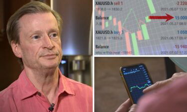 John Smith uses his smartphone to make investments. "This is an app here is making some trades
