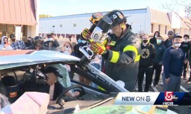 Students at MassBay Community College watched as Ashland Firefighters used the "Jaws of Life" to slice into a Dodge Dart.