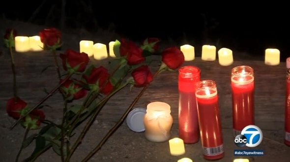 <i>KABC</i><br/>Roses and candles form a memorial for Daina Monroe