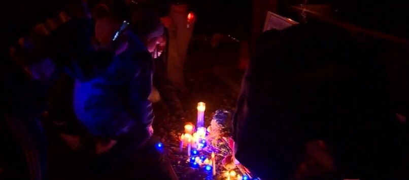 <i>WCVB</i><br/>Mourners attend an October 24 candleight vigil for 5-year-old Elijah Lewis