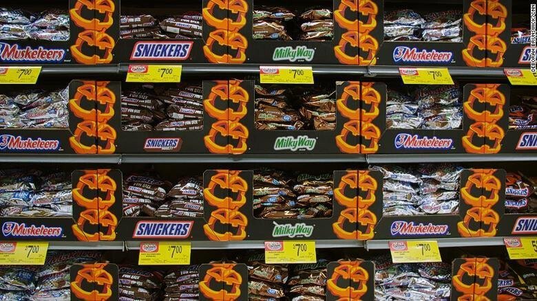 <i>CNN</i><br/>Halloween candy sits on a shelf at a grocery store ahead of the holiday. The Red Cross is highlighting both general physical safety tips and Covid-19 safety tips.