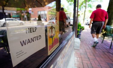 Entrepreneurs from New York City to Dallas say a labor shortage is holding them back. Restaurant storefront in New York has "Help Wanted" sign in window on July 15.