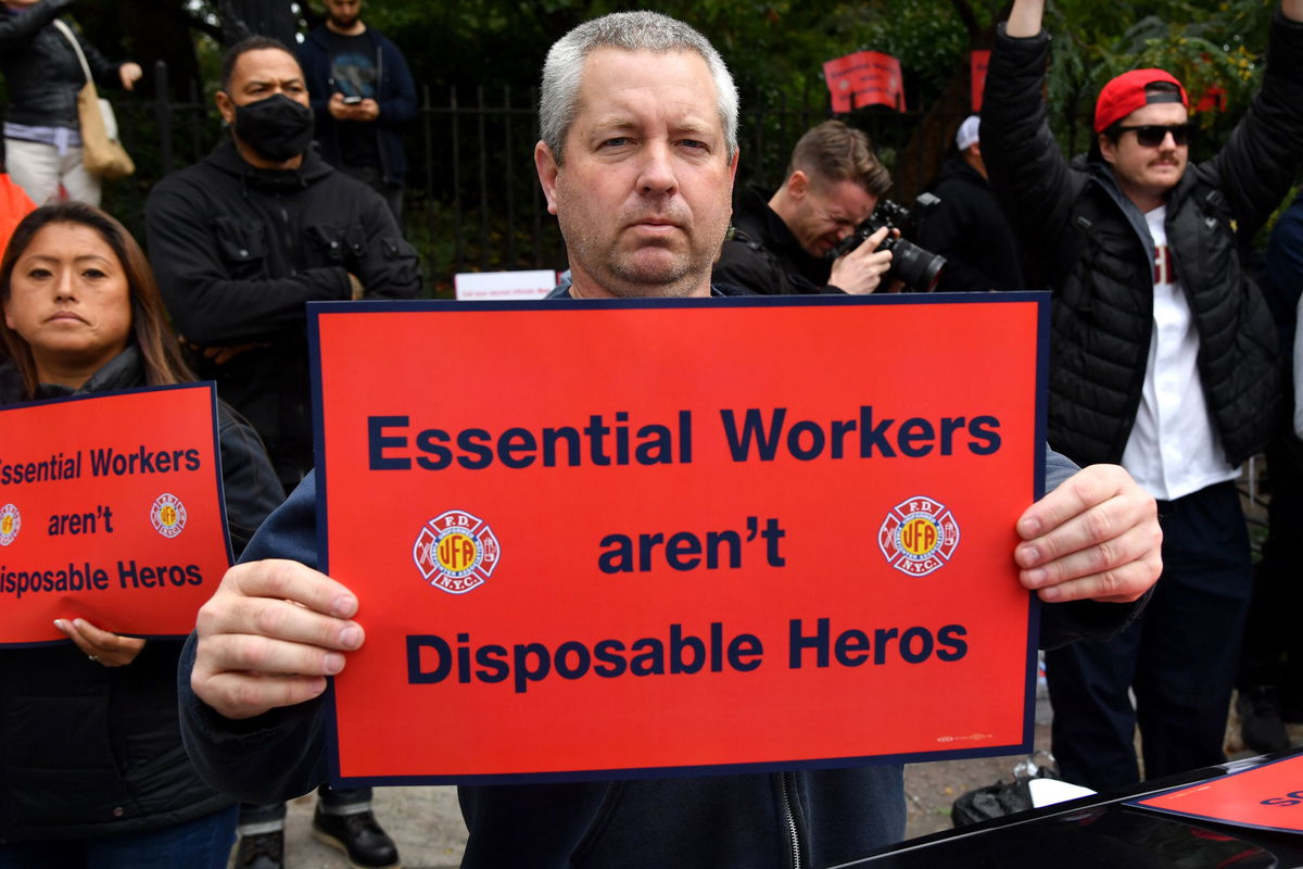 <i>Stephen Lovekin/Shutterstock</i><br/>A protester at Thursday's rally holds a sign that reads