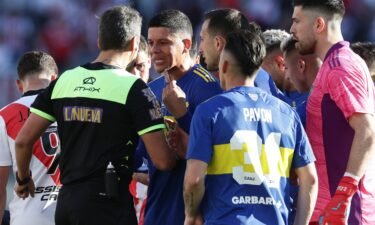Marcos Rojo argues with the referee after being sent off.
