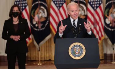 President Joe Biden delivers remarks on his proposed economic bill as Vice President Kamala Harris (L) looks on in the East Room of the White House on October 28