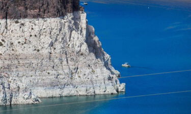 Vice President Kamala Harris will visit Lake Mead in Nevada on Monday. A boater gets an up-close view the "bathtub ring" that is visible at low water levels of Lake Mead and is the result of the deposition of minerals on previously submerged surfaces while touring the front of Hoover Dam