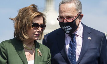 The Democratic Party's effort to finalize a sweeping economic package will be front-and-center on Capitol Hill this week. Speaker of the House Nancy Pelosi and Senate Majority Leader Charles Schumer are shown here attending a rally near the Capitol Reflecting Pool on Wednesday