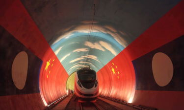 The Lane Xang EMU train passes by the China-Laos borderline inside a tunnel