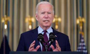 President Joe Biden on Tuesday will travel to Michigan to rally support for his twin economic packages. Biden is shown here in the State Dining Room of the White House