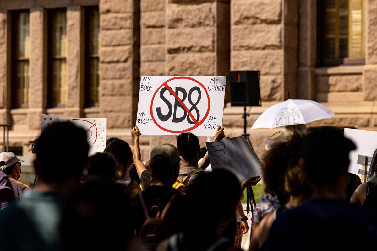 <i>Jordan Vonderhaar/Getty Images</i><br/>Texas Attorney General Ken Paxton urged a powerful federal appeals court on Thursday to allow a state law that bars abortion after the detection of a fetal heartbeat to remain in effect while legal challenges play out. Abortion rights activists rally at the Texas State Capitol on September 11