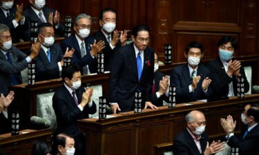 Fumio Kishida is applauded after being elected as Japan's new Prime Minister at the lower house of parliament in Tokyo on October 4.