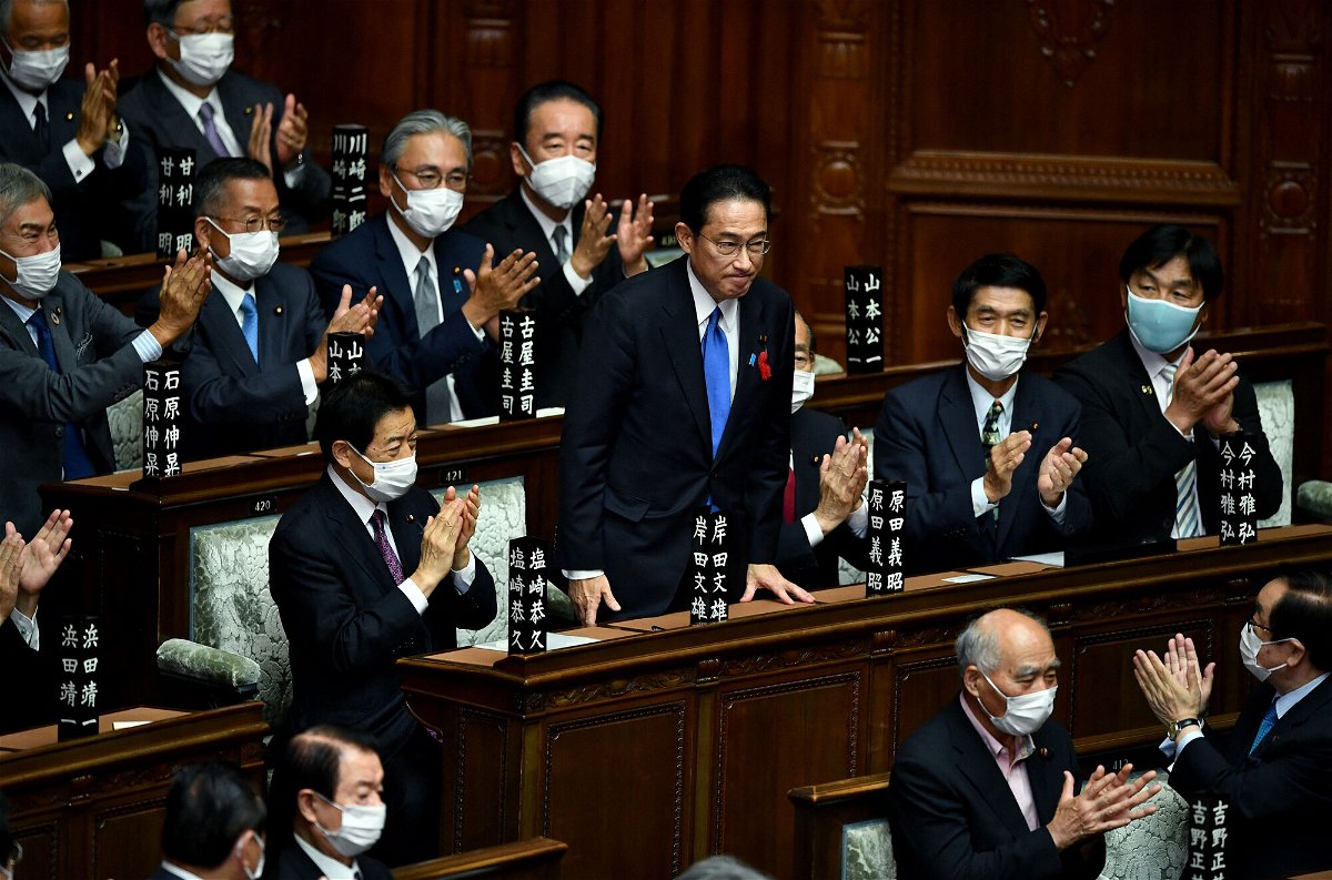 <i>KAZUHIRO NOGI/AFP/Getty Images</i><br/>Fumio Kishida is applauded after being elected as Japan's new Prime Minister at the lower house of parliament in Tokyo on October 4.