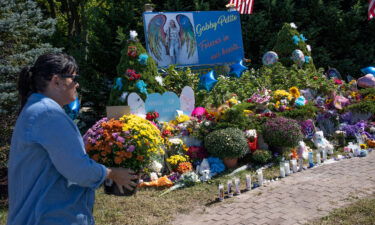 Authorities are scheduled to provide an update on Gabby Petito's final autopsy report. Members of the public leave flowers at a memorial site for Gabby Petito on September 26