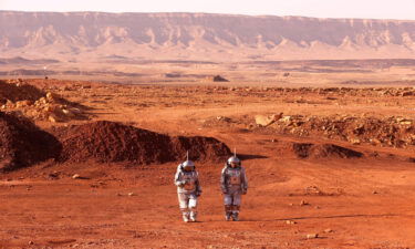 A couple of astronauts from a team from Europe and Israel walk in spacesuits during a training mission for planet Mars at a site that simulates an off-site station at the Ramon Crater in Mitzpe Ramon in Israel's southern Negev desert on October 10.